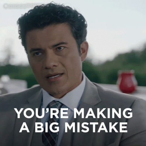 Man in Suit Making Big Mistake