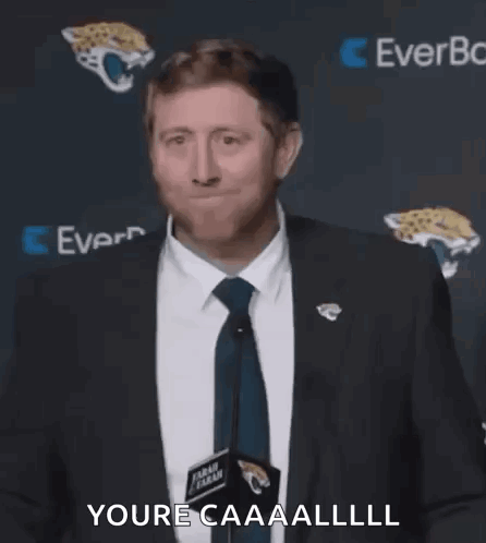Man In Suit Making Face At Microphone GIF