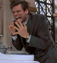 Man in Suit Making Face at Sink