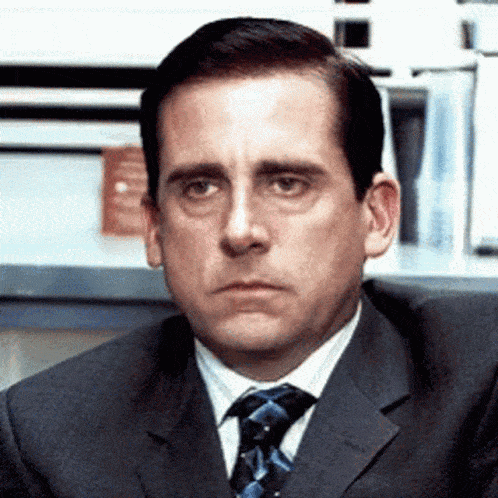 Man in Suit Making Face