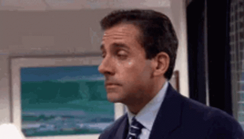 Man in Suit Making Face