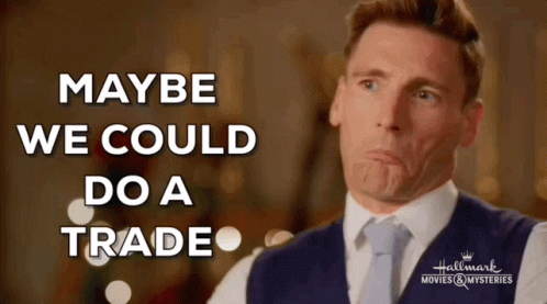 Man In Suit Making Face Saying Maybe We Could Do A Trade GIF