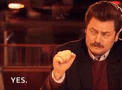 Man In Suit Making Fist And Saying Yes GIF