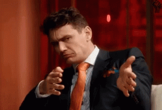 Man In Suit Making Funny Face GIF