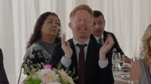 Man In Suit Making Funny Face At Wedding GIF