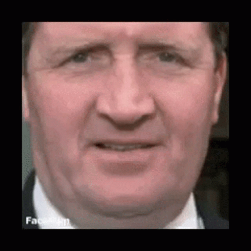 Man In Suit Making Funny Face GIF
