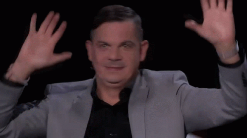 Man In Suit Making Funny Face Hands Up GIF