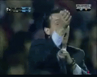 Man In Suit Making Funny Face In Crowd GIF