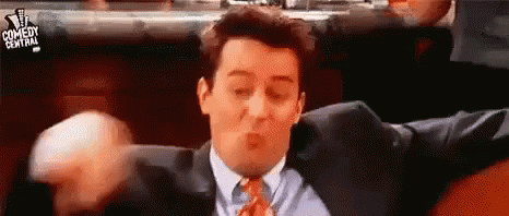Man In Suit Making Funny Face GIF