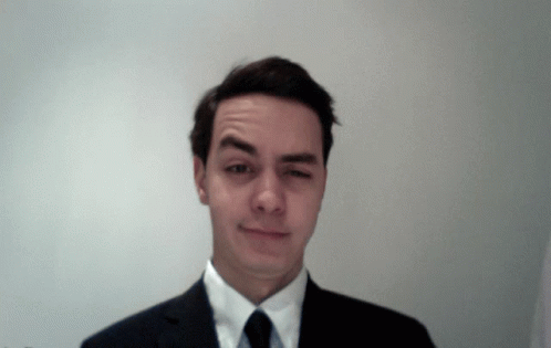 Man In Suit Making Funny Face GIF
