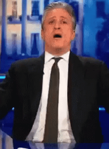 Man In Suit Making Funny Face GIF