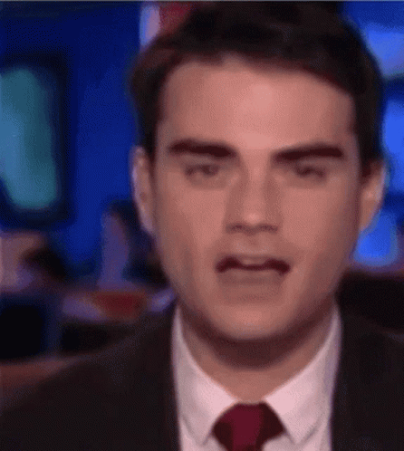Man In Suit Making Funny Face GIF