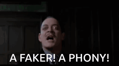 Man in Suit Making Funny Face Saying Faker