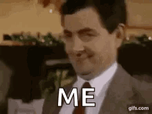 Man in Suit Making Funny Face Saying Me
