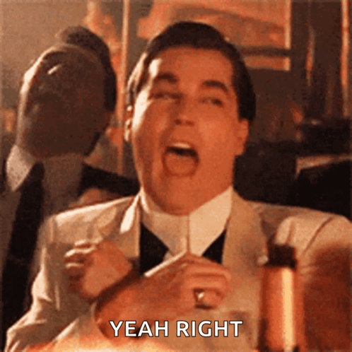 Man in Suit Making Funny Face Saying Yeah Right