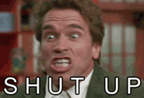 Man in Suit Making Funny Face Shut Up
