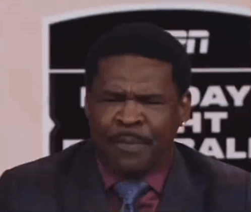 Man in Suit Making Funny Face With Hands