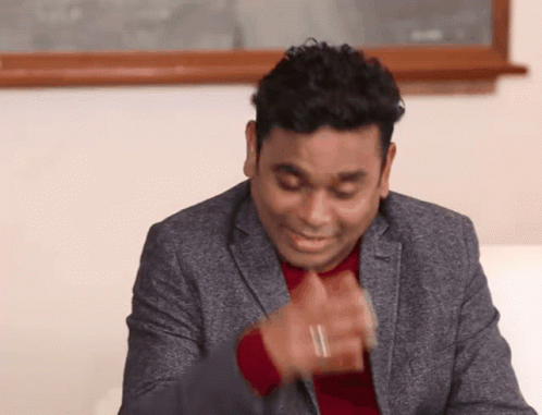 Man In Suit Making Funny Face With Hands GIF