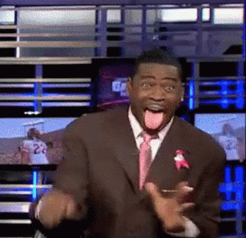 Man in Suit Making Funny Face With Tongue Out