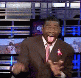 Man in Suit Making Funny Face With Tongue Out