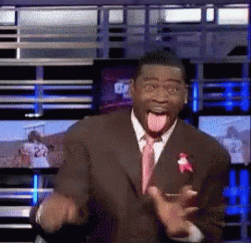 Man in Suit Making Funny Face With Tongue Out