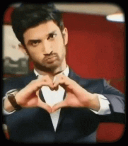 Man In Suit Making Heart Shape GIF