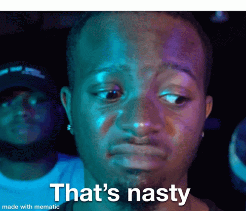 Man in Suit Making Nasty Face