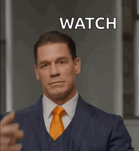Man in Suit Making Peace Sign Watch