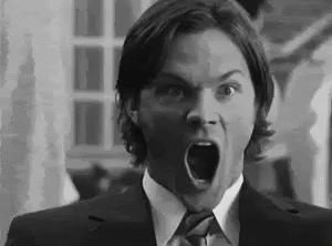 Man in Suit Making Surprised Face