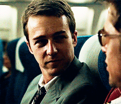 Man in Suit Next to Man in Sunglasses