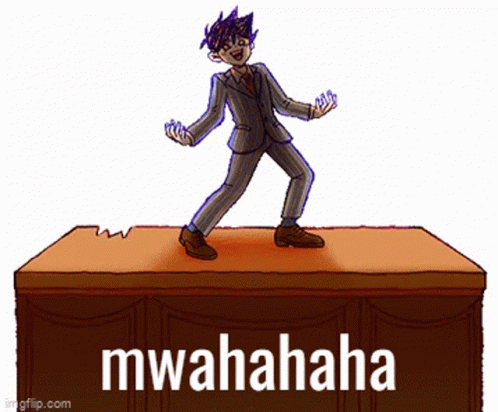 Man In Suit On Desk Saying Mwahaha GIF