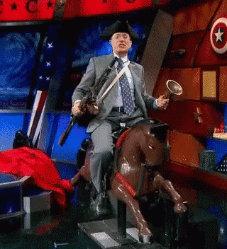 Man In Suit On Rocking Horse Holding Trumpet GIF