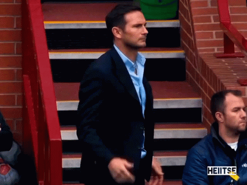 Man in Suit on Stairs Heitse