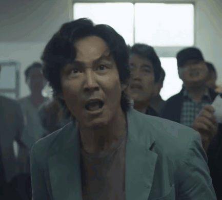 Man in Suit Open Mouth in Crowd