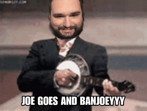 Man in Suit Playing Banjo Joe Goes and Banjoeyy
