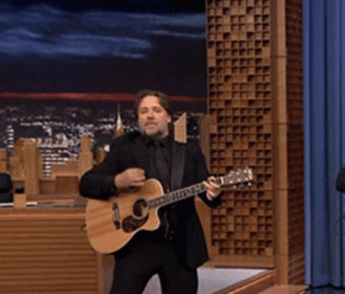 Man in Suit Playing Guitar It's Ur and Into My Car