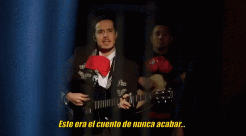 Man in Suit Playing Guitar with Never Ending Story