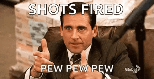Man in Suit Pointing at Camera