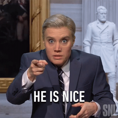 Man In Suit Pointing At Camera Saying He Is Nice GIF