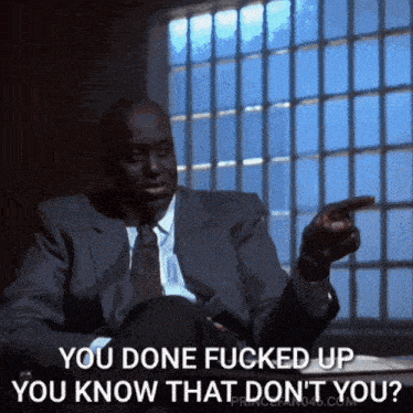 Man in Suit Pointing at Someone