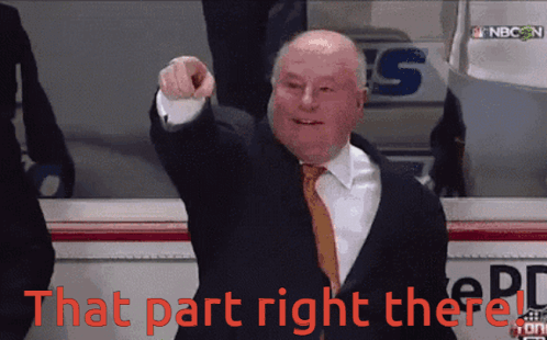 Man in Suit Pointing at That