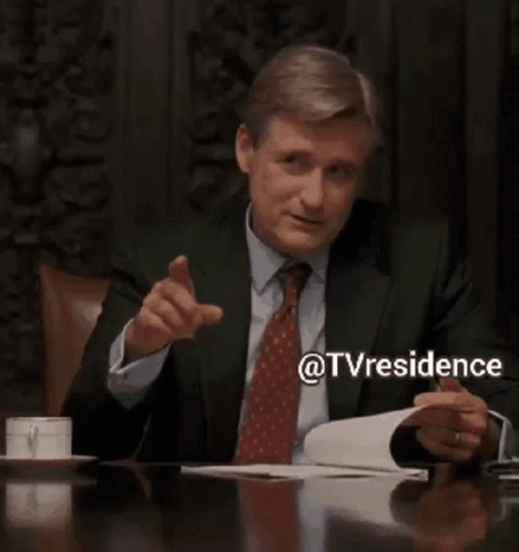 Man in Suit Pointing