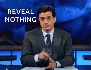 Man in Suit Pointing Saying Reveal Nothing