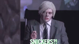 Man in Suit Pointing Saying Snickers