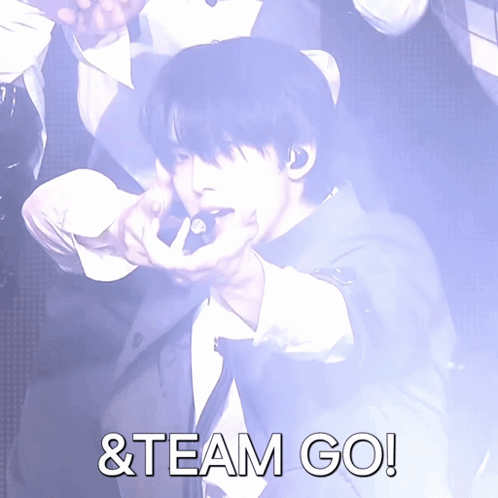Man in Suit Pointing with Team Go