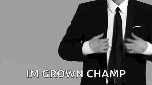 Man in Suit Putting on Jacket and Tie