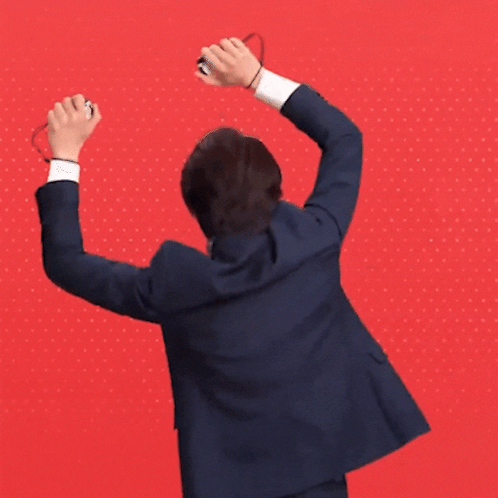 Man in Suit Raising Arms