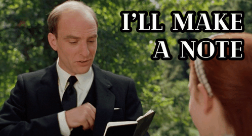 Man in Suit Reading Book to Girl