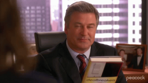 Man in Suit Reading Dealbreakers