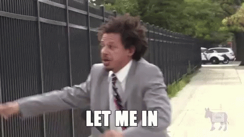 Man in Suit Running with Let Me In